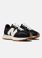 New Balance 327 Women's Sneaker in Black/White Angled Side View