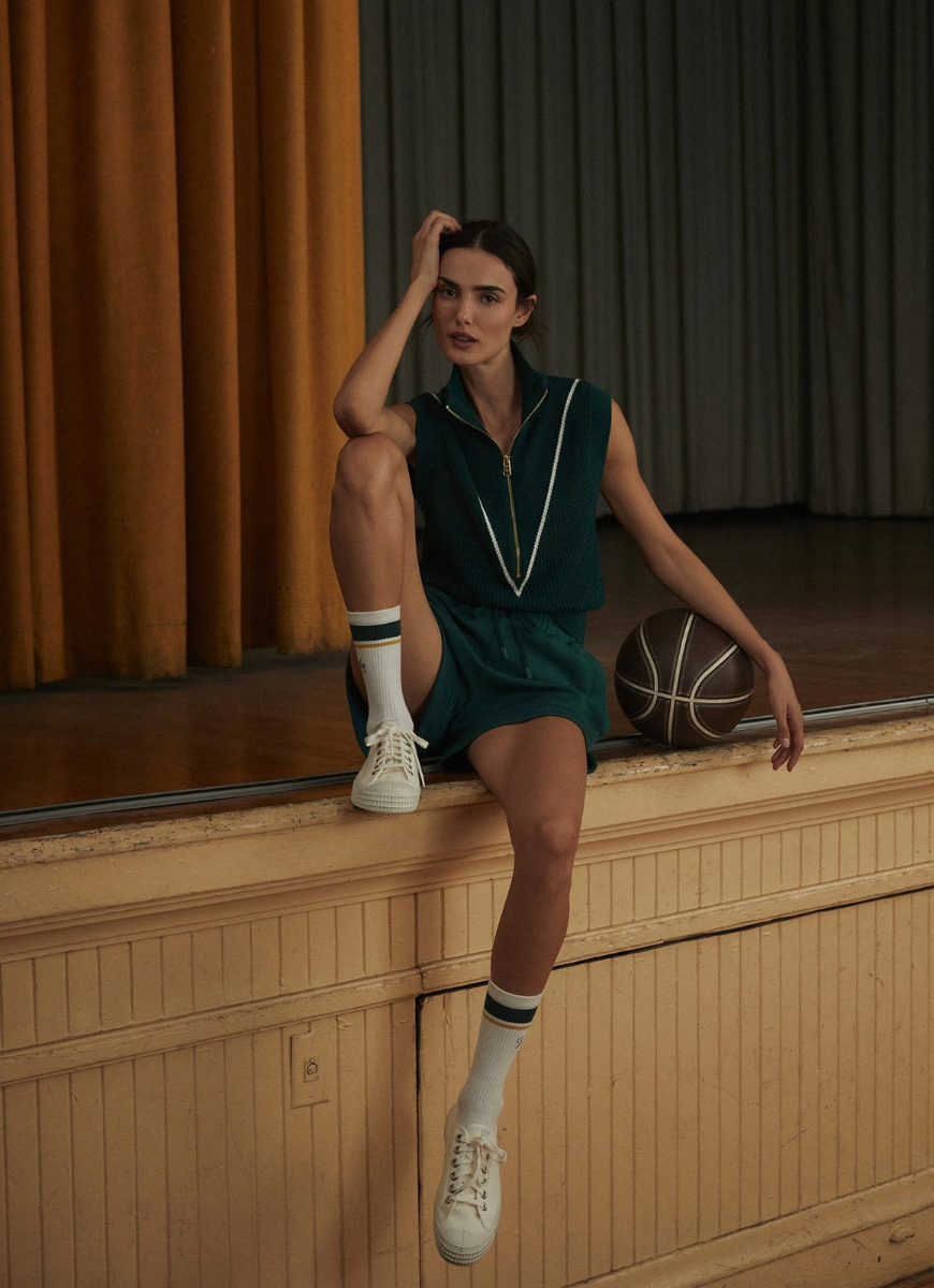 Varley Allena Half Zip Vest in Forest Model Posing With a Basketball