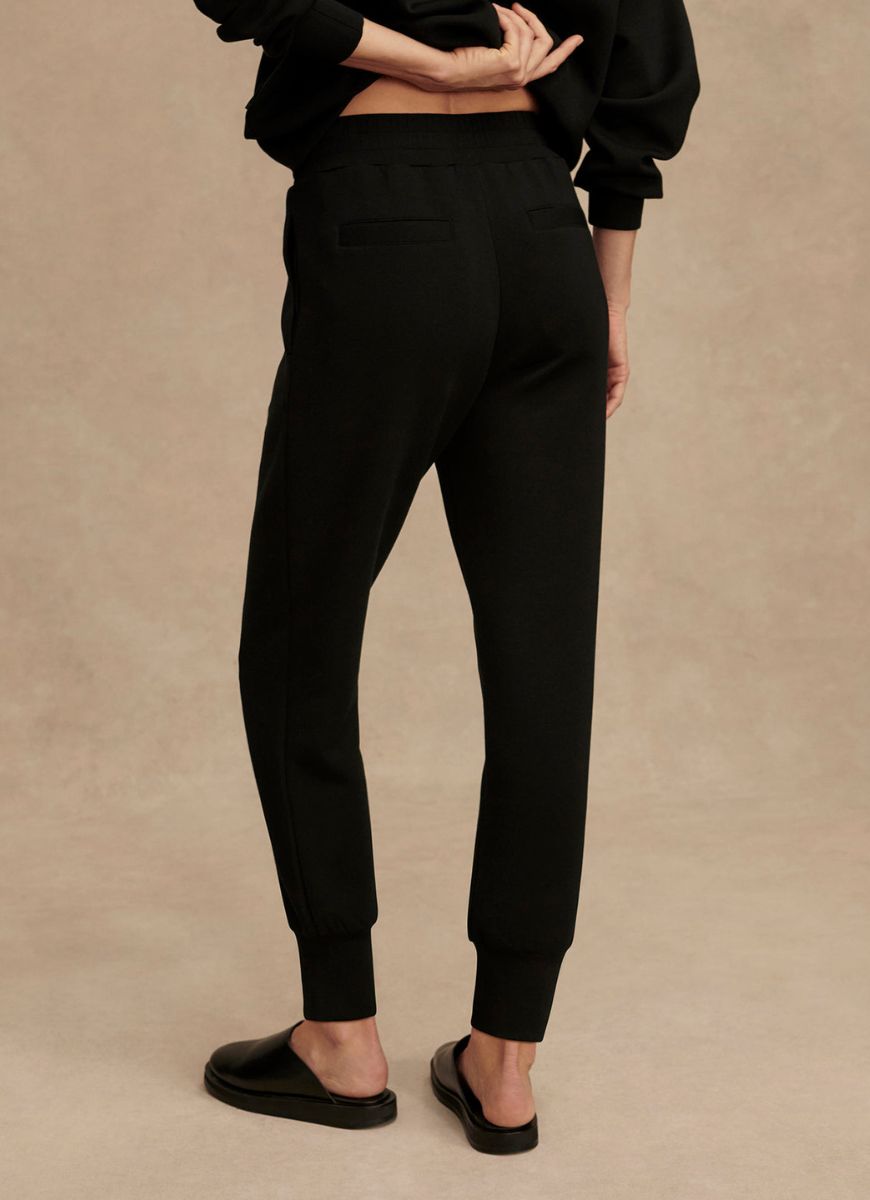 Varley The Slim Cuff Pant 25” in Black Waist Down Back View With Alternate Background