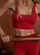 Varley Freesoft Cori Sports Bra in Lava Falls Front View With Model in a Studio Gym