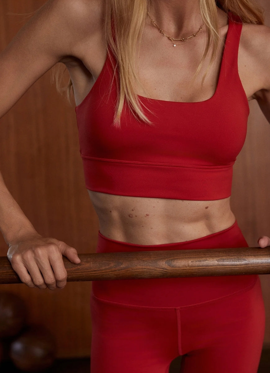 Varley Freesoft Cori Sports Bra in Lava Falls Front View With Model in a Studio Gym