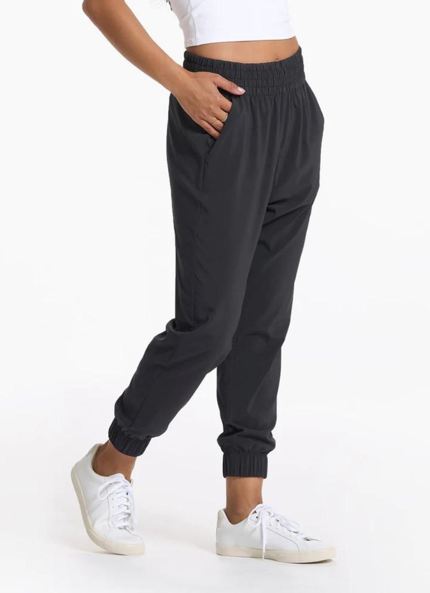 Vuori Women's Villa Jogger in Black Waist Down View with Hand in Pocket