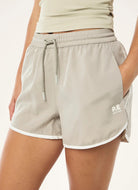 P.E Nation Academy Short in Biscuit Close Up Front View of Hand in Pocket