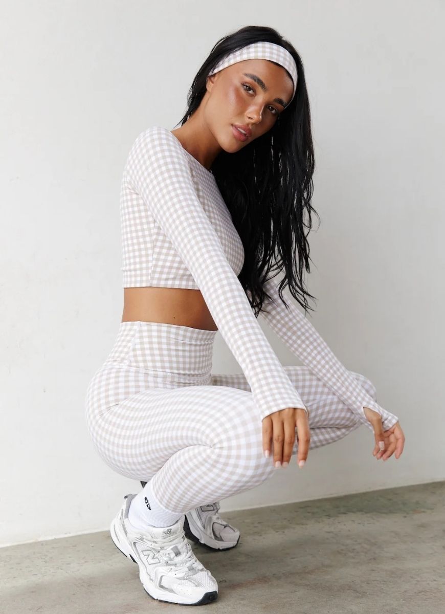Astoria Luxe Balance Full Length Legging in Beige Gingham Side View With Model in a Squat Pose