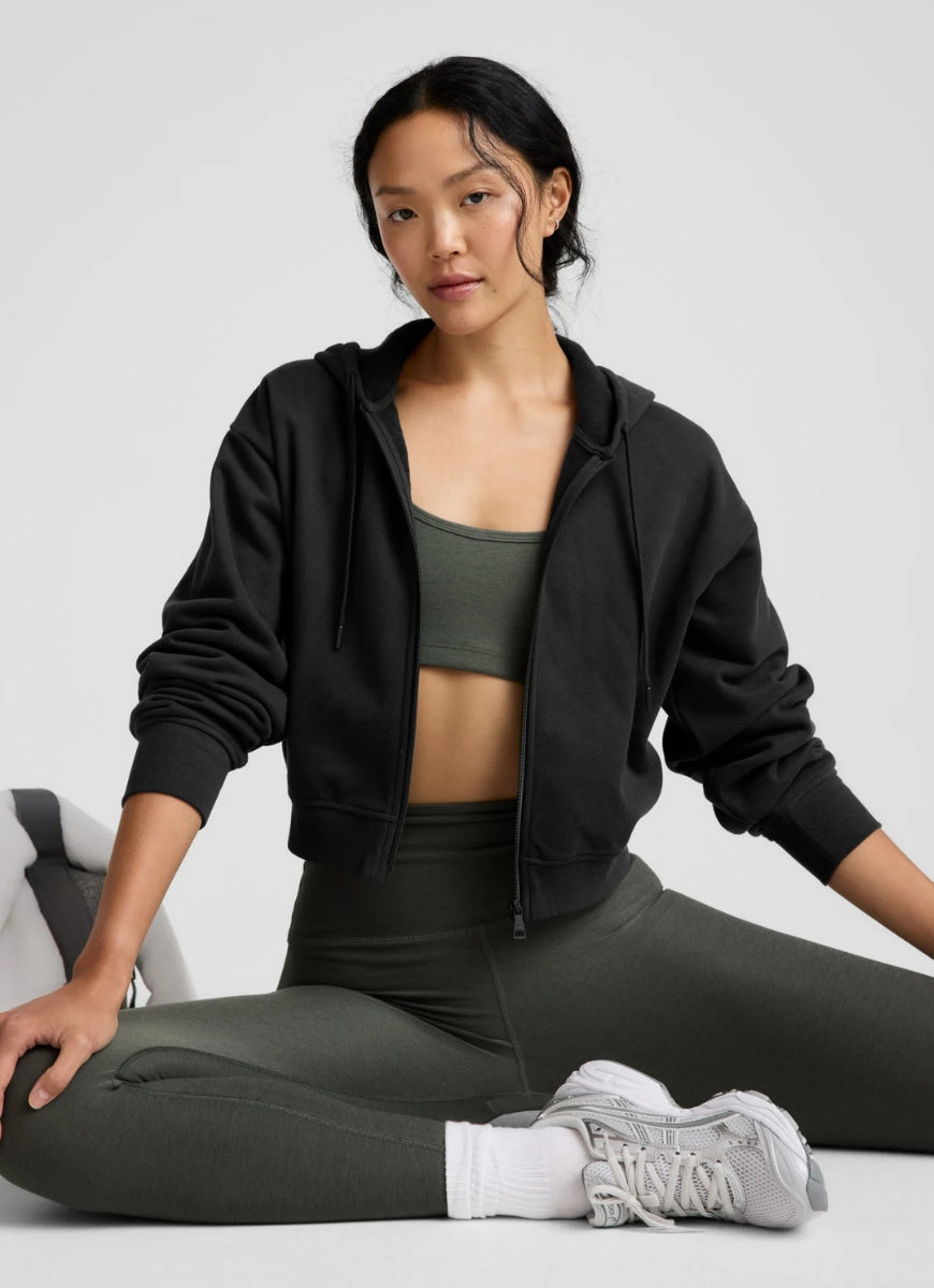 Beyond Yoga Spacedye Caught In The Midi High Waisted Legging in Dusty Forest Heather Model Sitting Down in a Pose