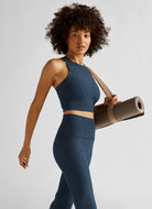 Beyond Yoga Spacedye Refocus Cropped Tank in Navy Side View With Model Holding a Yoga Mat