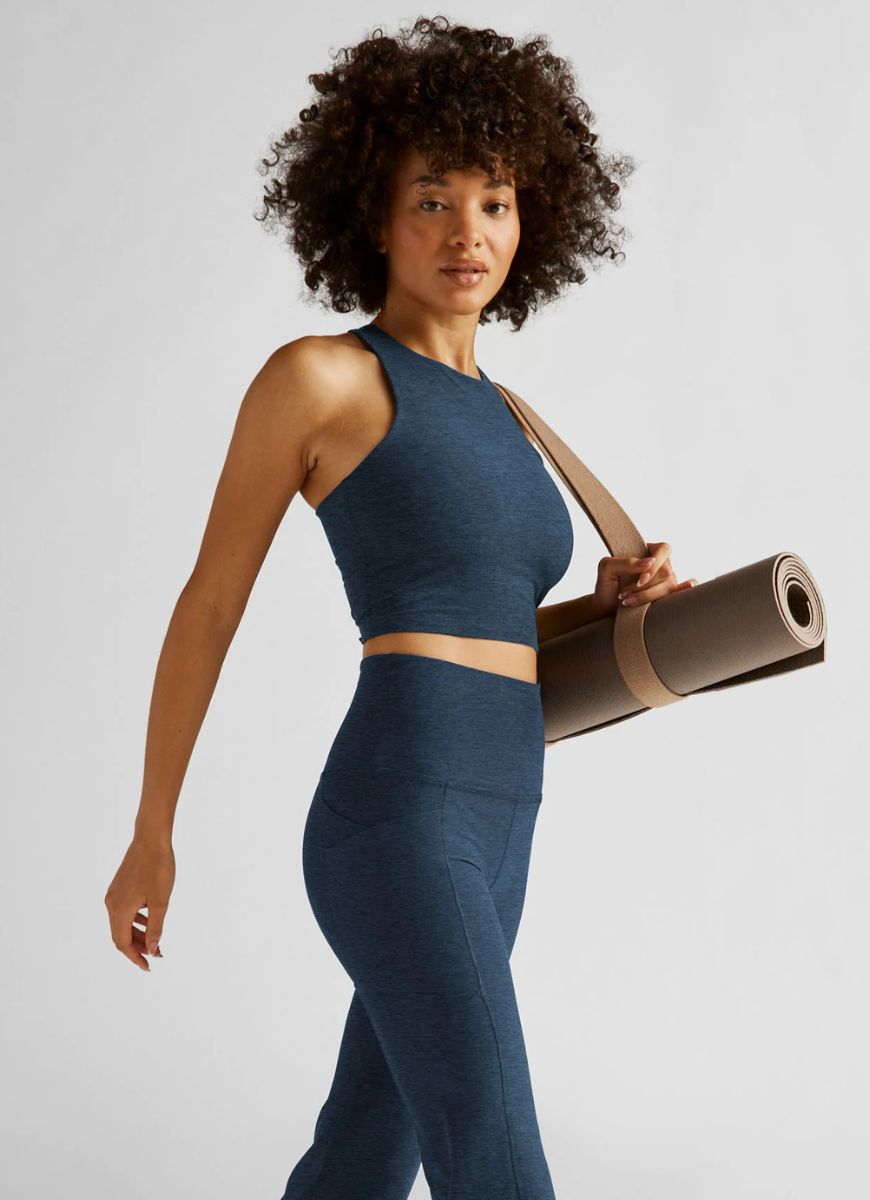 Beyond Yoga Spacedye Refocus Cropped Tank in Navy Side View With Model Holding a Yoga Mat
