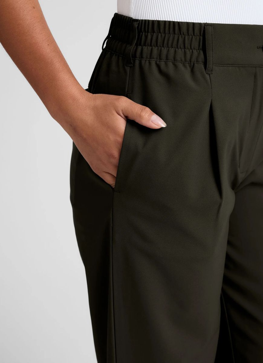 Beyond Yoga Status Wide Leg Trousers in Olive Ink Close Up View of Hand in Pocket