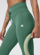 Vuori Daily Pocket Legging in Hedge Green Close Up Side View