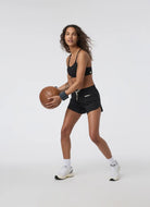 Vuori Dynamic Sports Bra in Black Model Shown Playing Basketball