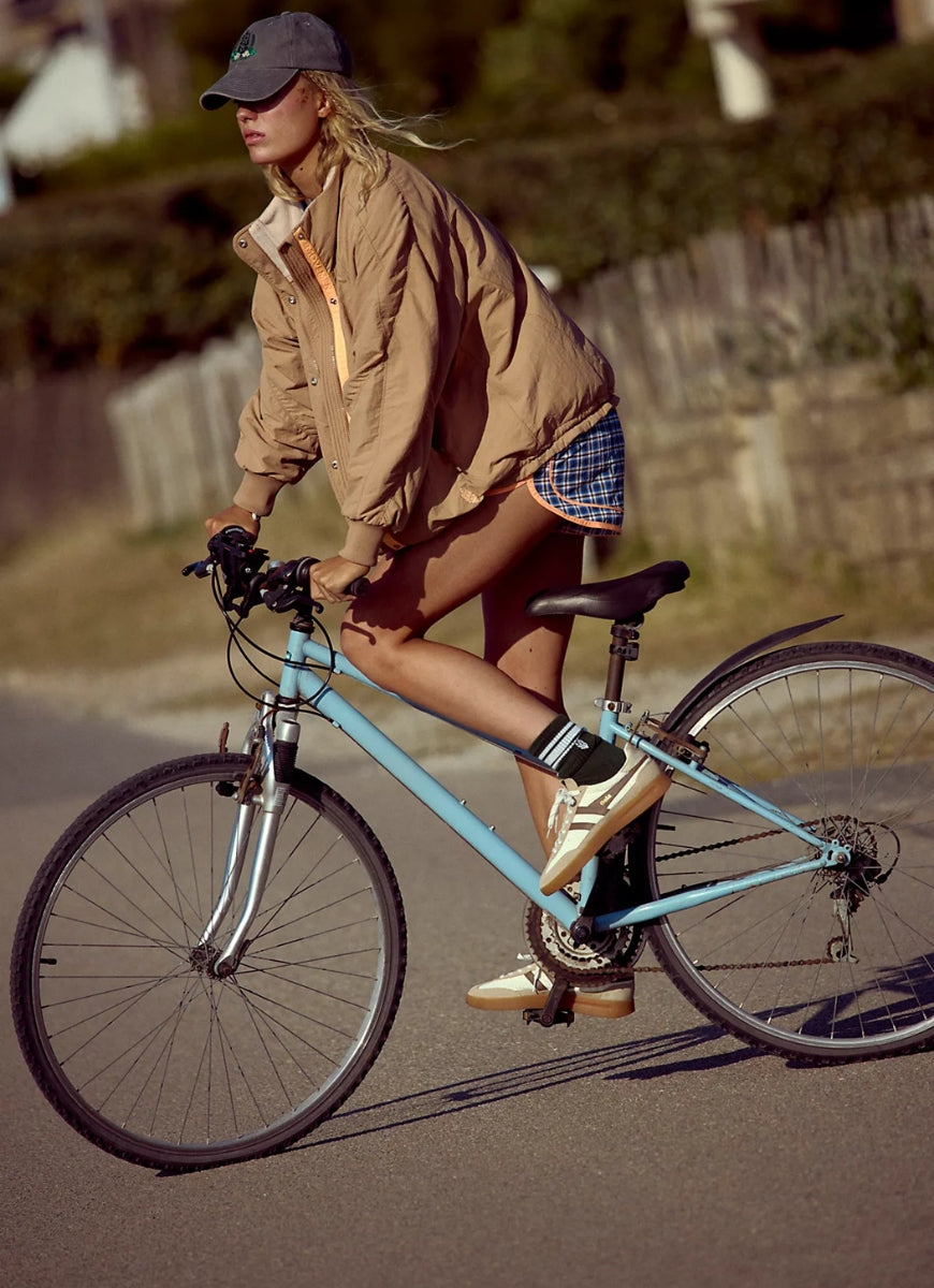 Free People Field Tripper Jacket in Light Camel Combo Side View Model Shown Riding a Bike