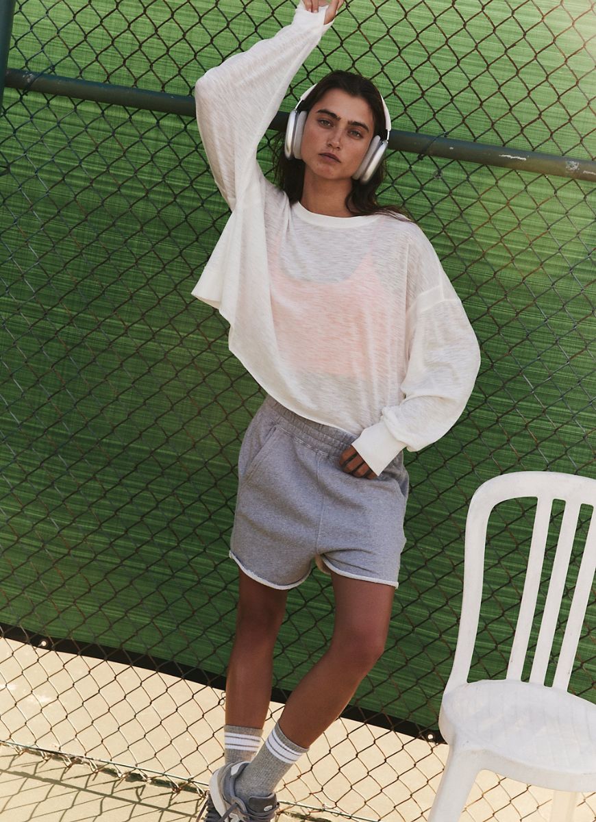Free People My Time Layer Tee in White Model Standing on a Court