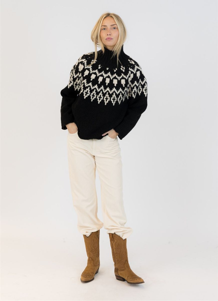 Lyla + Luxe Aggie Fairisle Crewneck Pullover Sweater in Black/White Front View Model With Hands in Pockets