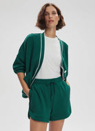 Varley Ollie High Rise Short 3.5" in Forest Front View With Hands in Pockets