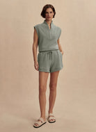 Varley Ollie High Rise Short 3.5” in Shadow Full Length Front View With Hand in Pocket