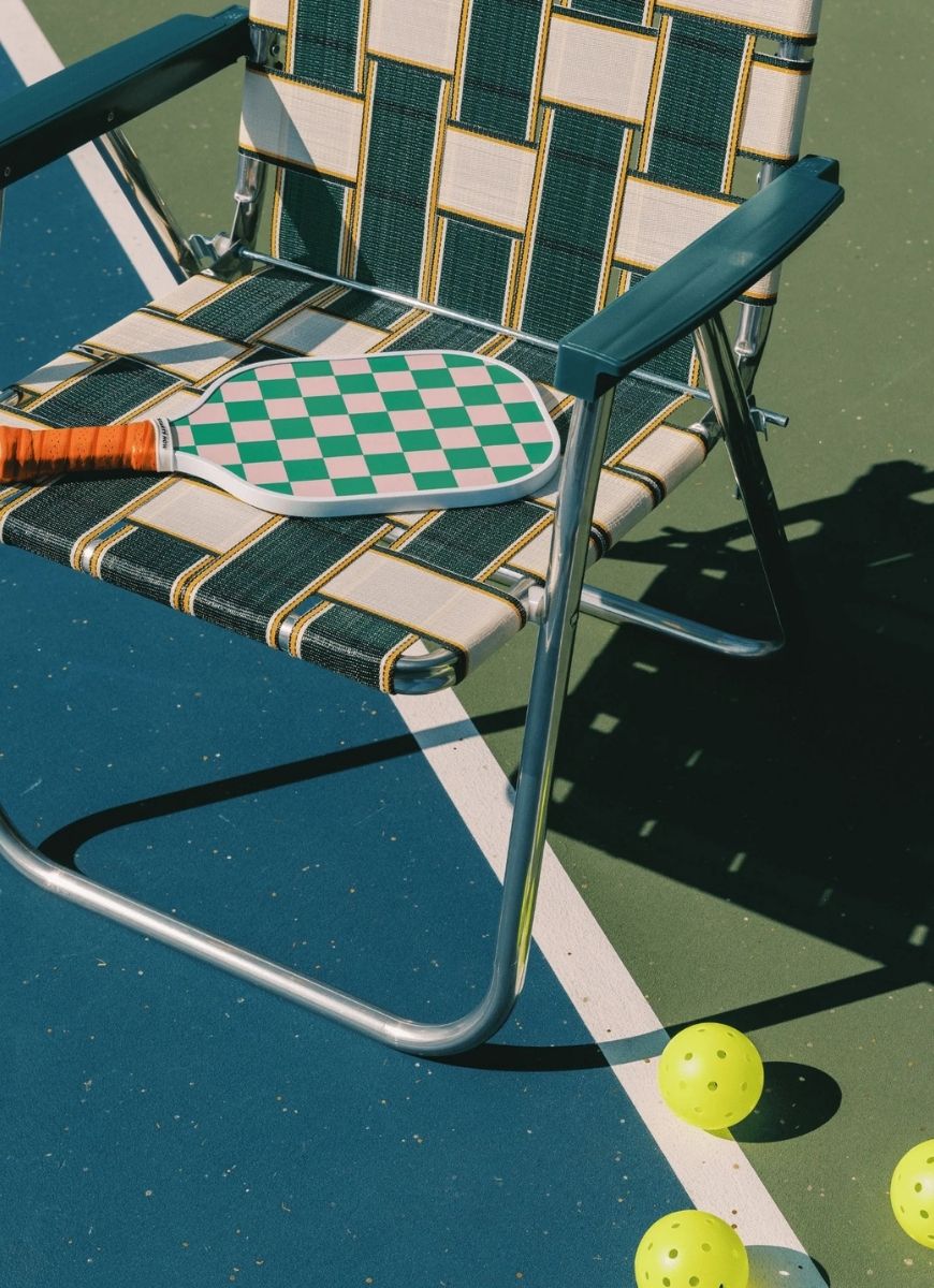 On Holiday Palma Pickleball Paddle Shown Laying on a Chair