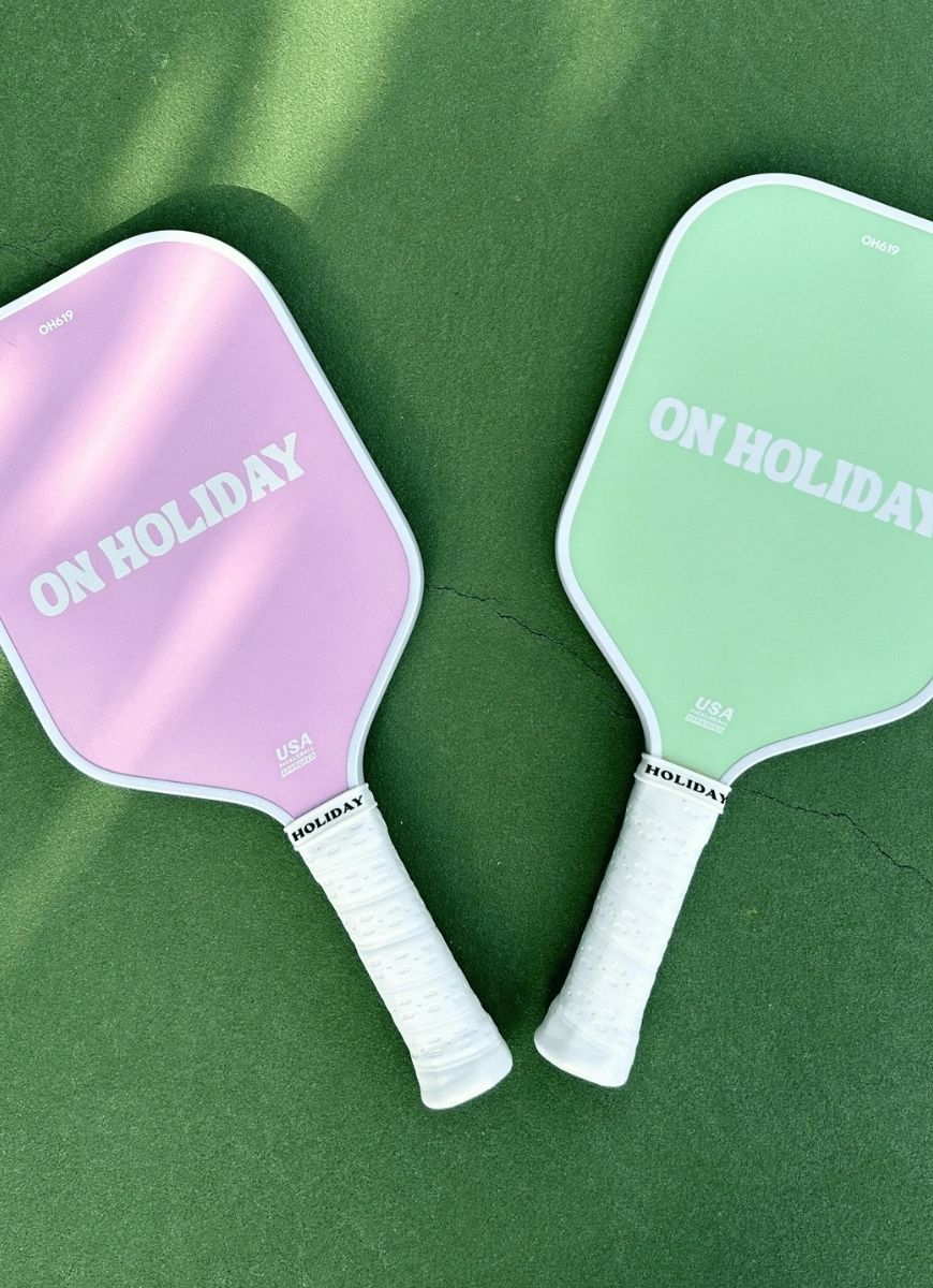 On Holiday Performance Lime Pickleball Paddle 2 Shown Laying Flat on Green Court