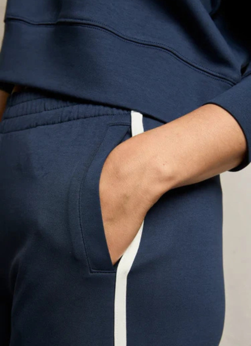 perfectwhitetee Mikos Wide Leg Pants in Navy Close Up View of Hand in Pocket