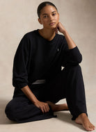 Polo Ralph Lauren Crew Neck And Wide Leg Pant Set in Black Model Sitting Down