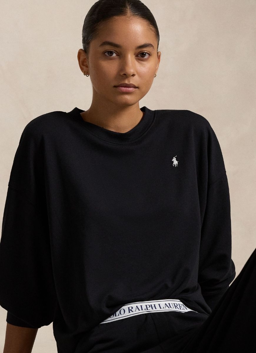 Polo Ralph Lauren Crew Neck And Wide Leg Pant Set in Black Front View With Model Sitting Down