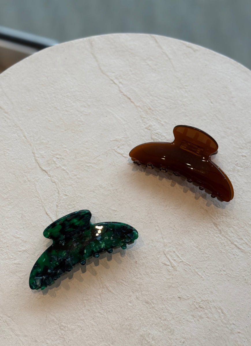 Claw Hair Clip in Brown Displayed on White Table