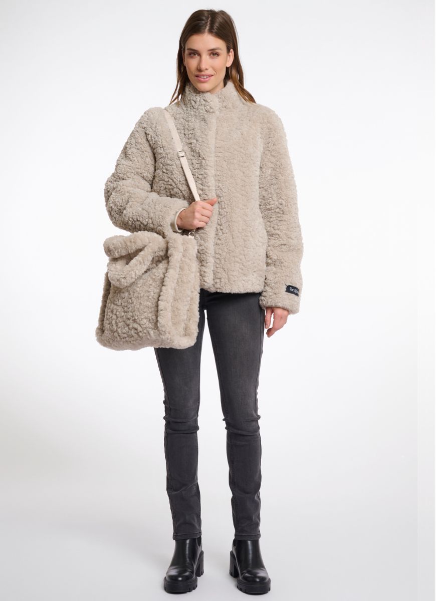 Rino & Pelle Brax Shopper Bag in Beige Shown on Model Carrying Bag Over Shoulder