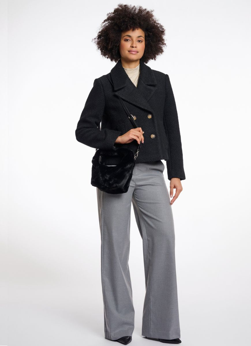 Rino & Pelle Cheryl Crossbody Bag in Black Model Shown Carrying Bag