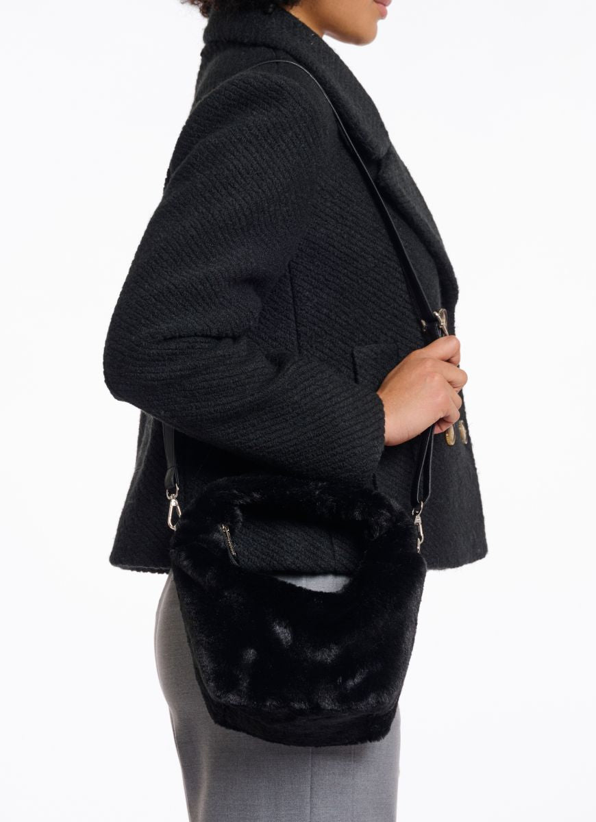 Rino & Pelle Cheryl Crossbody Bag in Black Side View Shown Over Shoulder