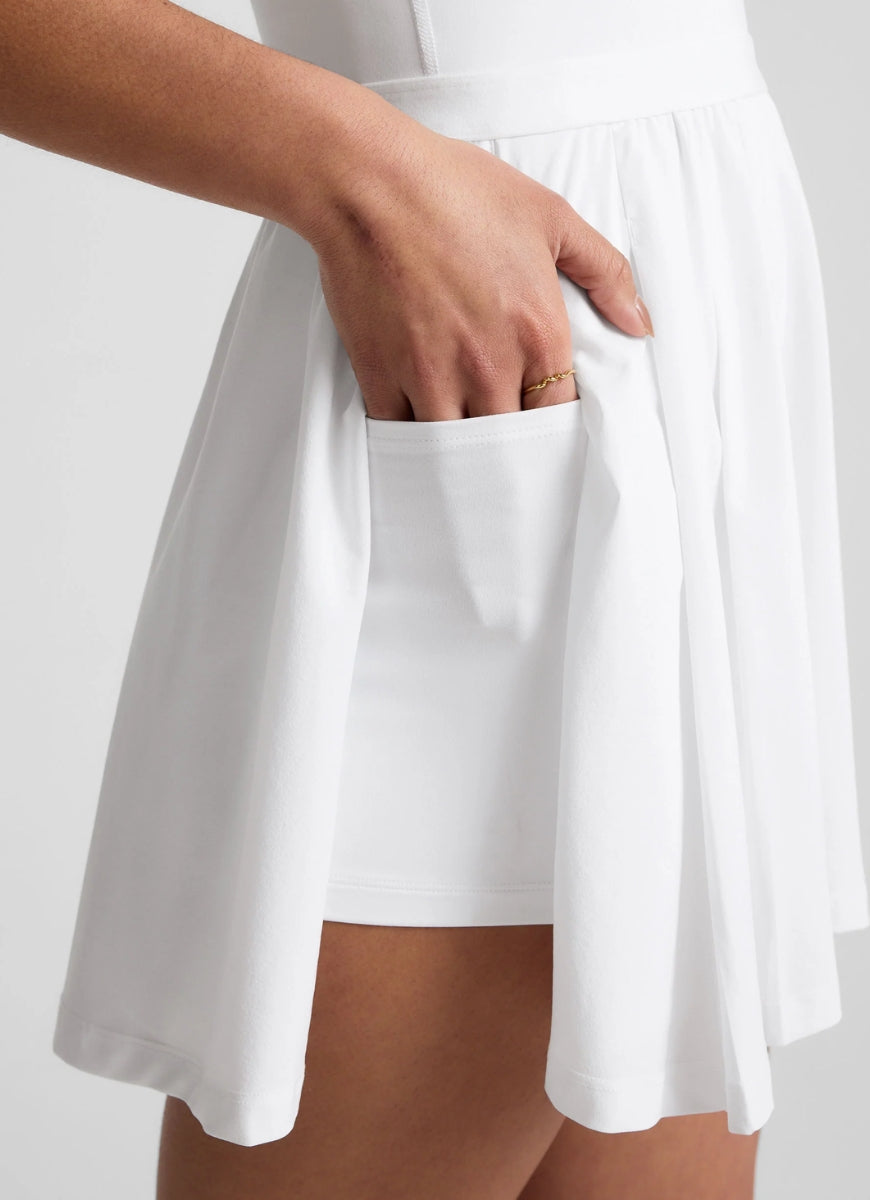 Beyond Yoga Score Pleated Dress in White Close Up View of Hand in Pocket