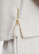 Varley Shea Crop Tank in Ivory Marl Close Up View of Side Zipper