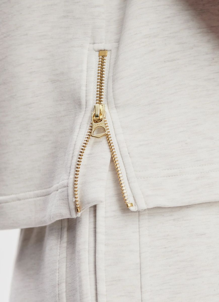 Varley Shea Crop Tank in Ivory Marl Close Up View of Side Zipper