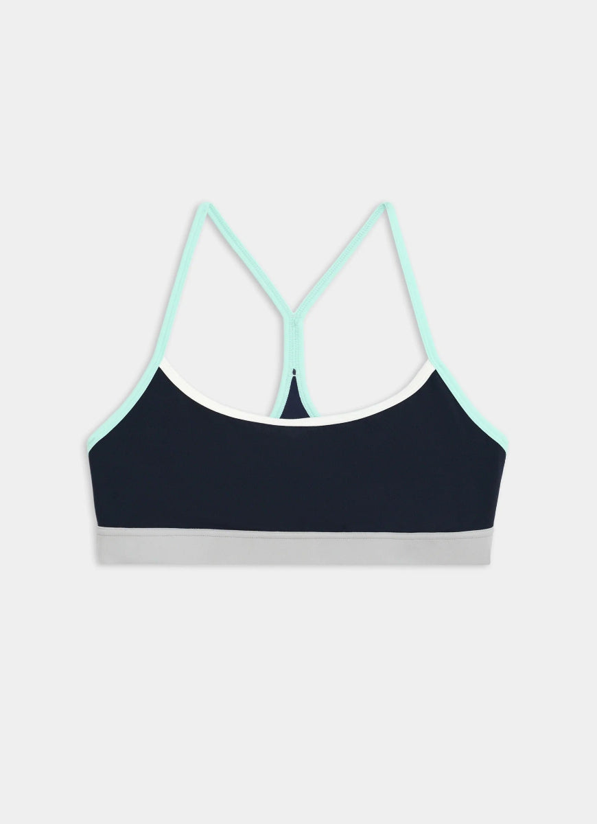 Black sports bra with light blue straps on a white background
