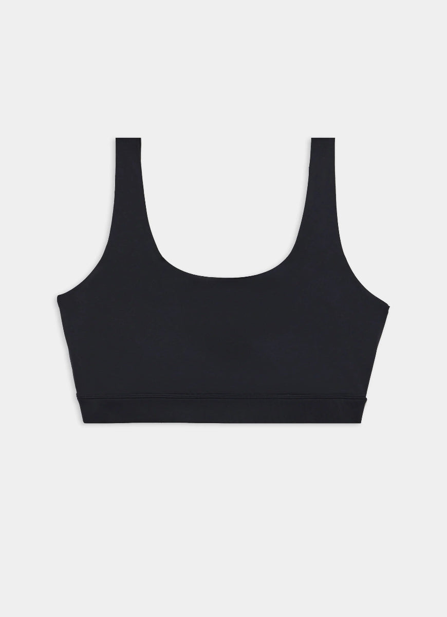 Black sports bra on a light gray background