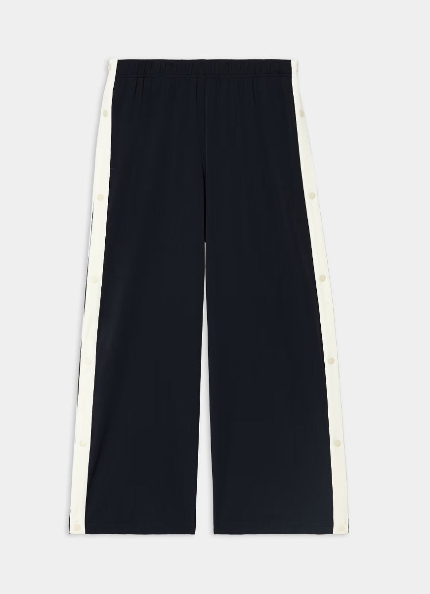 Brown pants with button details on a white background