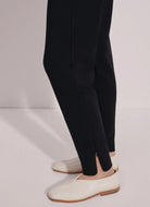 Varley The Slim Zip Hem Pant 29.5” in Black Close Up Side View of Ankle Zipper