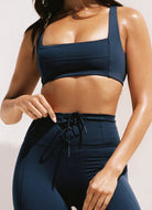 LSPACE Uppercut Sports Bra in Midnight Blue Close Up Front View