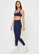 LSPACE Uppercut Sports Bra in Midnight Blue Full Length Angled Side View