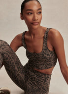 Varley Freesoft Cori Sports Bra in Brown Contrast Cheetah Model Sitting Down