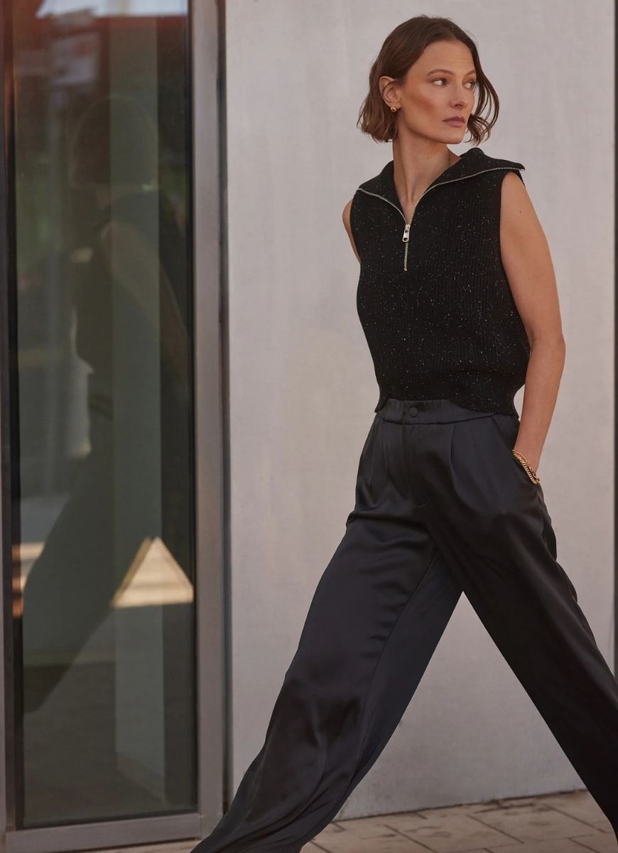 Varley Hally Half Zip Rib Vest in Black Fleck Model Walking on Sidewalk