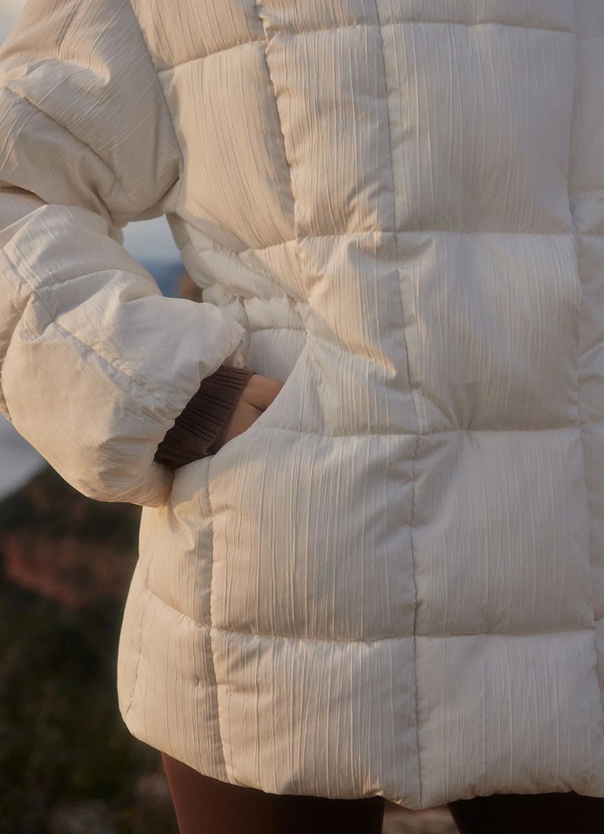 Varley Kaia Quilted Coat in Jet Stream Close Up View of Hand in Pocket
