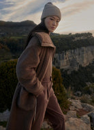 Varley Logan Sherpa Coat in Ash Taupe Model Shown Hiking in the Mountains