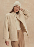 Varley Serina Reversible Quilt Jacket in Sandshell Front View With Jacket Unzipped