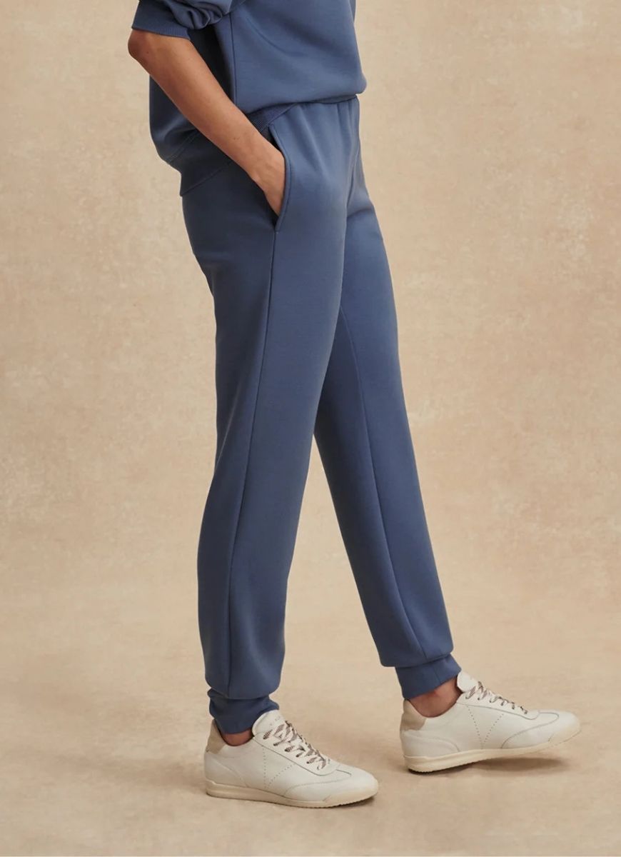 Varley The Slim Cuff Pant 27.5” in Bijou Blue Side View With Hand in Pocket