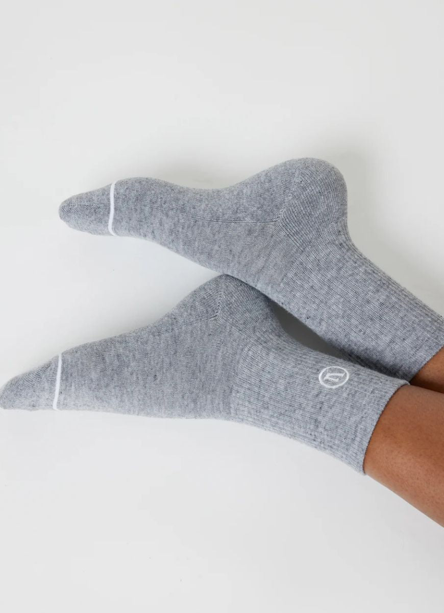 Vuori Half Crew Sock in Heather Grey Side View Shown on Feet