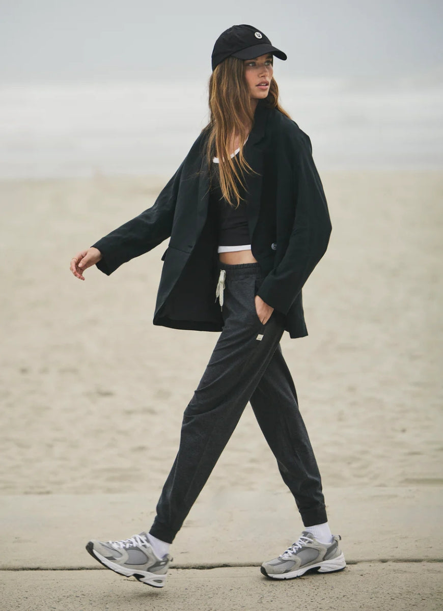 Vuori Performance Jogger in Charcoal Heather Model Showing Walking