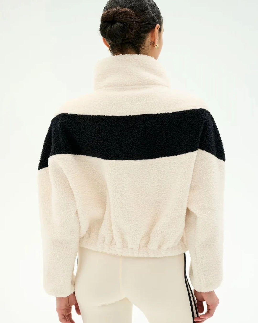 Women's black and cream colourblock fleece jacket styled with matching leggings from Splits59 at relevé