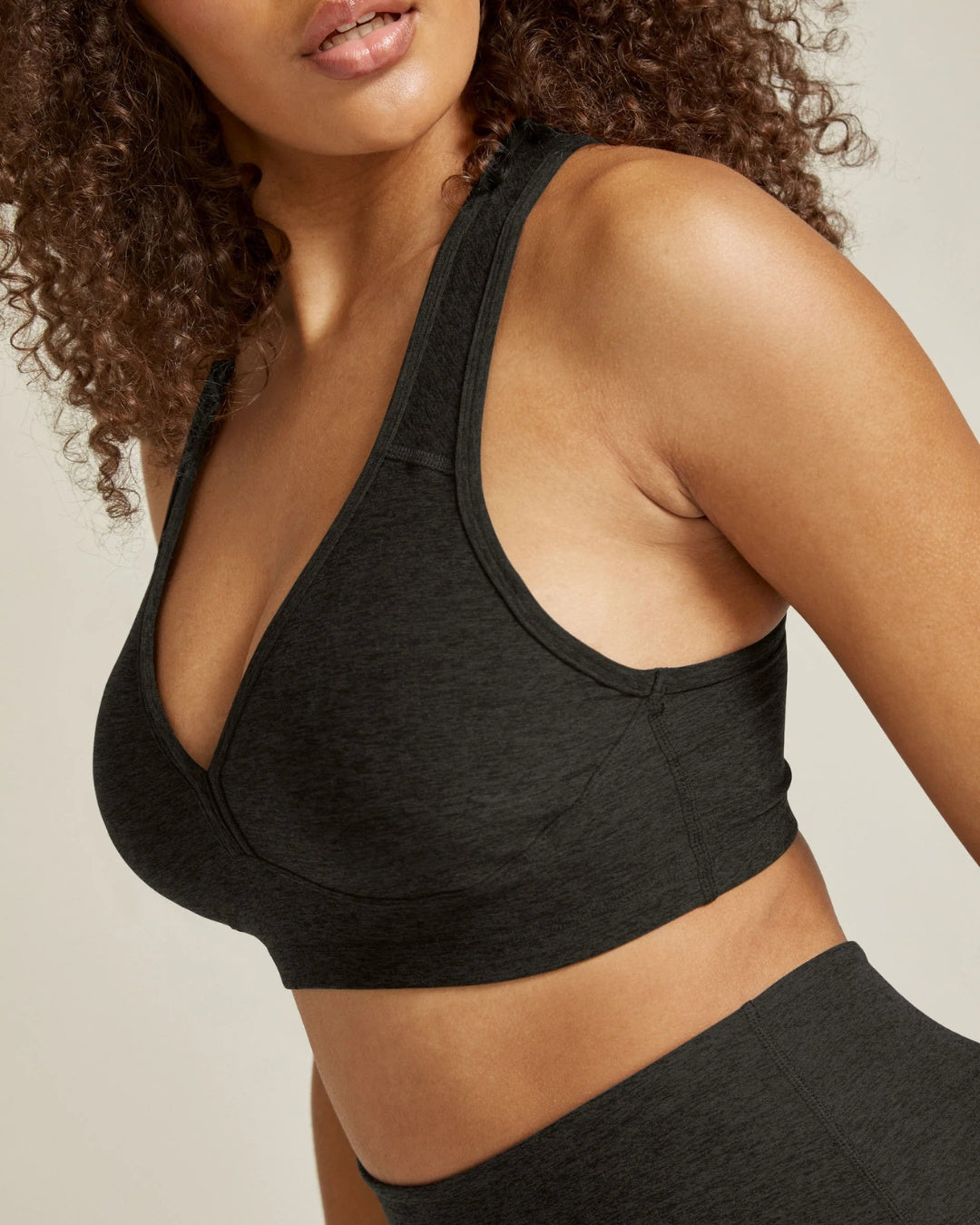 Beyond Yoga Collections Showing Side View of Model Wearing Beyond Yoga Sports Bra