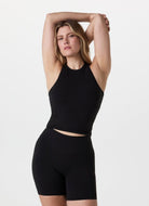 Vuori AllTheFeels Crew Tank Top in Black Front View With Model in a Pose