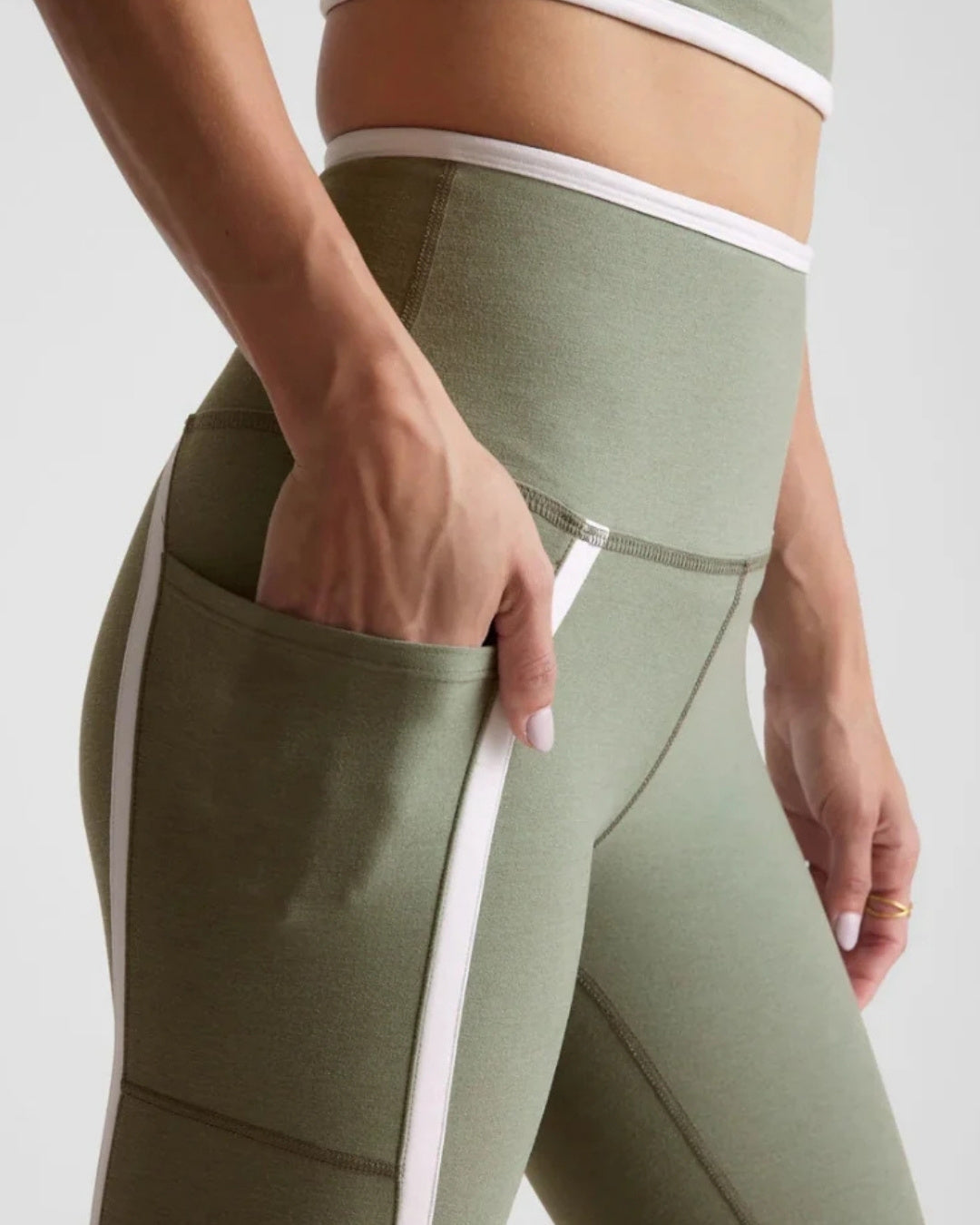 Beyond Yoga Spacedye New Moves High Waisted Midi Legging in Grey Sage/Cloud White Close Up Side View With Hand in Pocket