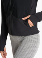 Vuori Women's Chilled Out Full Zip Jacket in Washed Black Close Up View of Hand in Pocket